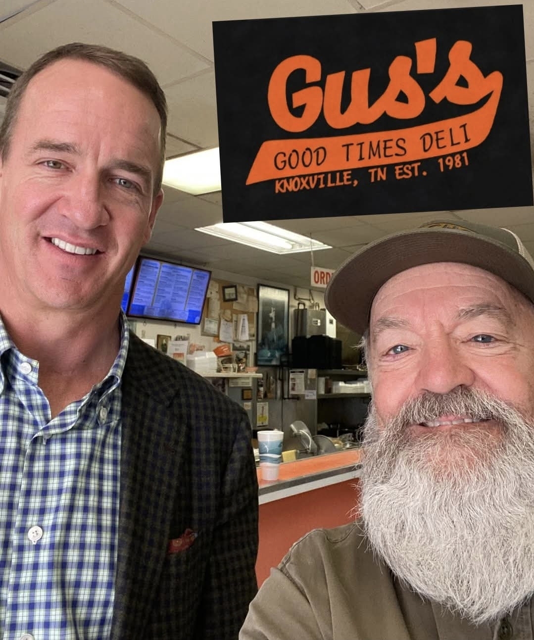 Peyton Manning with Gus owner at Gus's Good Times Deli